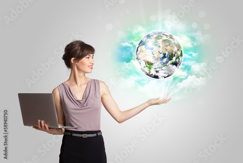 Photo: Young woman with earth and cloud concept Young woman with earth and cloud concept