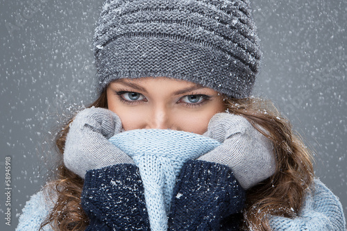 Photo: Cute girl in winter clothing with snowflakes Cute girl in winter clothing with snowflakes