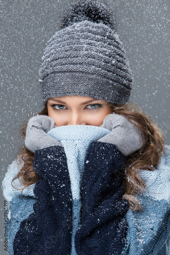 Photo: Cute girl in winter clothing with snowflakes Cute girl in winter clothing with snowflakes