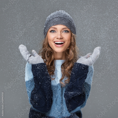 Photo: Cute girl in winter clothing with snowflakes Cute girl in winter clothing with snowflakes