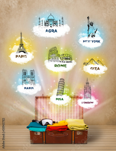 Photo: Tourist suitcase with famous landmarks around the world Tourist suitcase with famous landmarks around the world