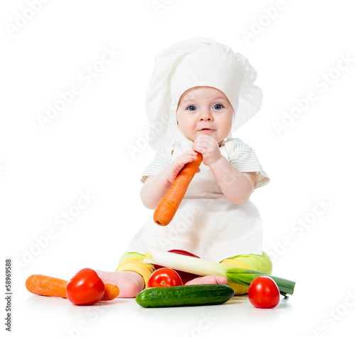 Photo: baby girl with vegetables baby girl with vegetables