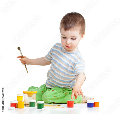 Photo: child painting with brush child painting with brush