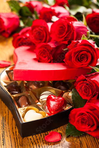 Photo: box of chocolate truffles with red roses box of chocolate truffles with red roses