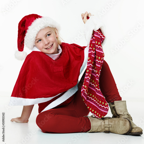 Photo: Cute girl with Santa Claus Cute girl with Santa Claus