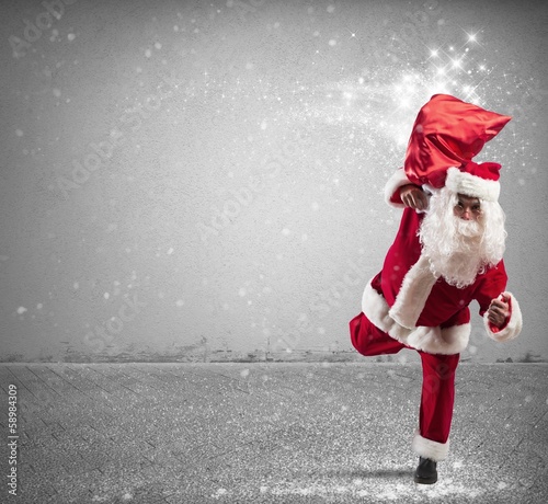 Photo: Running Santa Claus with magic gifts Running Santa Claus with magic gifts