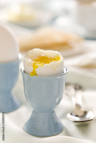 Photo: Breakfast table with a soft-boiled egg. Breakfast table with a soft-boiled egg.