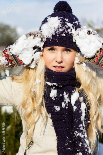 Photo: beautiful winter woman playing with snow beautiful winter woman playing with snow