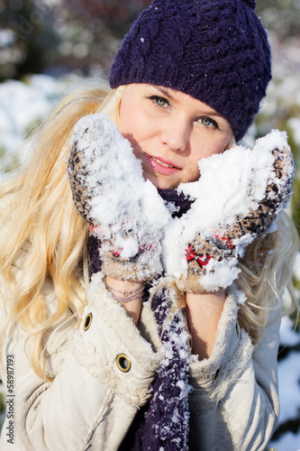 Photo: beautiful winter woman playing with snow beautiful winter woman playing with snow