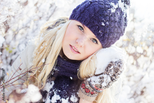 Photo: beautiful winter woman playing with snow beautiful winter woman playing with snow