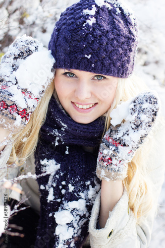 Photo: beautiful winter woman playing with snow beautiful winter woman playing with snow