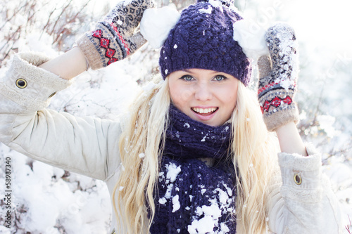 Photo: beautiful winter woman playing with snow beautiful winter woman playing with snow