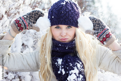 Photo: beautiful winter woman playing with snow beautiful winter woman playing with snow