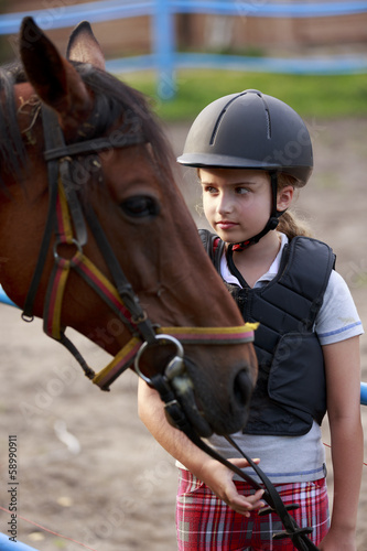 Photo: Horse and lovely equestrian girl Horse and lovely equestrian girl