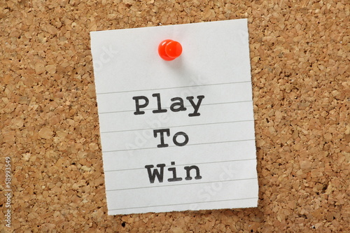 Photo: Play To Win on a cork notice board Play To Win on a cork notice board