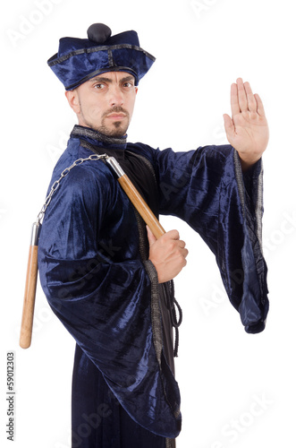 Photo: Martial arts master with nunchucks on white Martial arts master with nunchucks on white