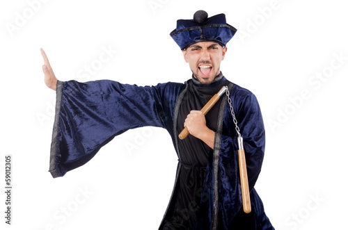 Photo: Martial arts master with nunchucks on white Martial arts master with nunchucks on white