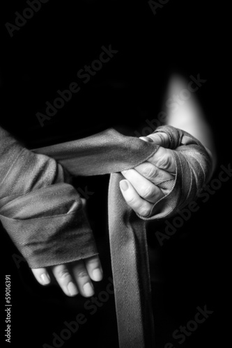 Photo: Woman wrapping her hands Woman wrapping her hands