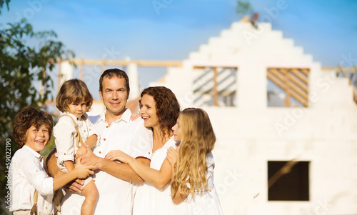 Photo: Family building a new house Family building a new house