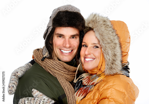 Photo: Happy christmas couple in winter clothing. Happy christmas couple in winter clothing.