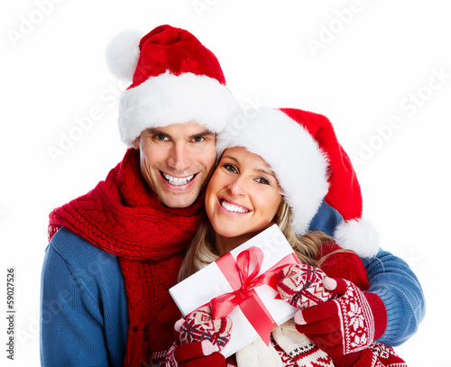 Photo: Happy couple with christmas present. Happy couple with christmas present.