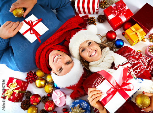 Photo: Happy couple with christmas present. Happy couple with christmas present.