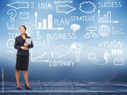 Photo: Business woman standing near Innovation plan. Business woman standing near Innovation plan.