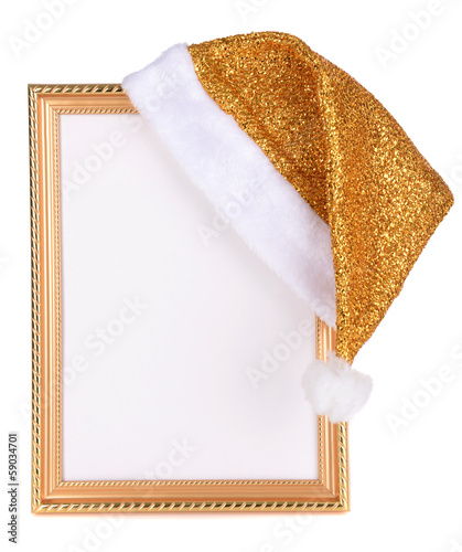 Photo: Christmas hat hung on old frame isolated on white Christmas hat hung on old frame isolated on white