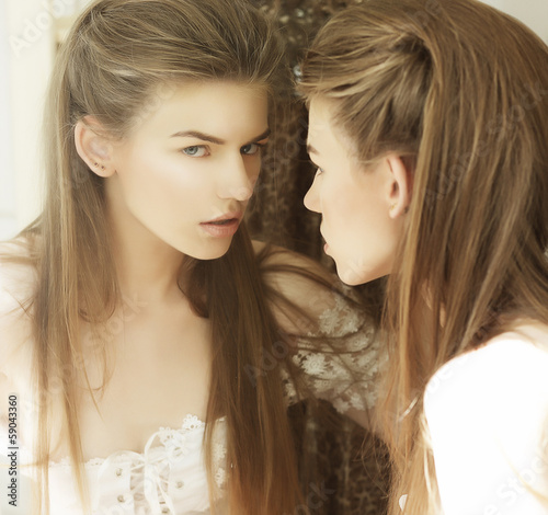 Photo: Delusion. Image of Beautiful Woman in Front of a Mirror Delusion. Image of Beautiful Woman in Front of a Mirror