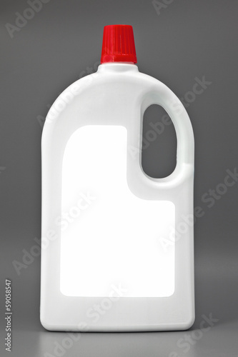 Photo: White detergent plastic bottle isolated on gray White detergent plastic bottle isolated on gray