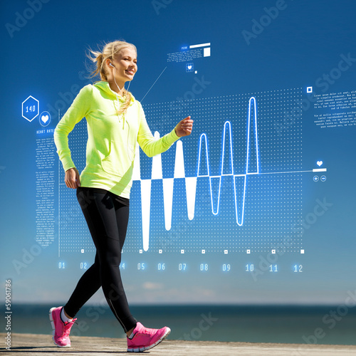Photo: smiling woman doing sports outdoors with earphones smiling woman doing sports outdoors with earphones