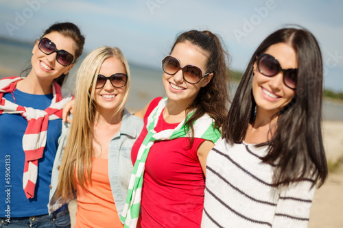 Photo: beautiful teenage girls having fun on the beach beautiful teenage girls having fun on the beach