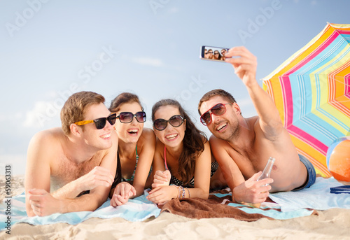 Photo: group of people taking picture with smartphone group of people taking picture with smartphone
