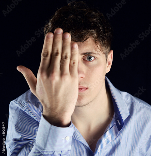 Photo: Man hiding half of his Face Man hiding half of his Face
