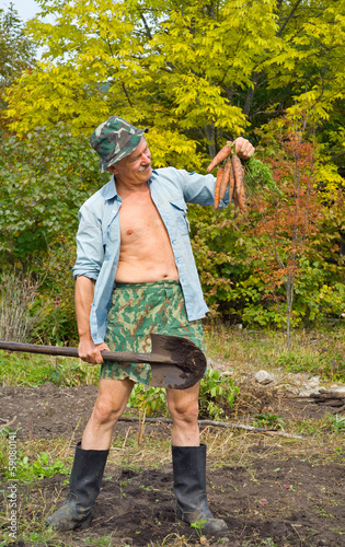 Photo: Man with spade and carrot 3 Man with spade and carrot 3