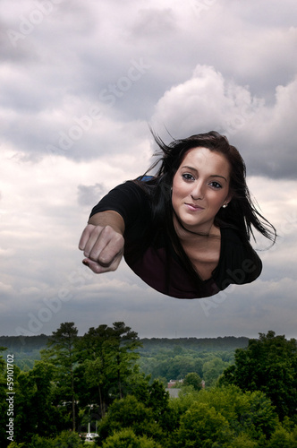 Photo: Woman Flying Through the Sky Woman Flying Through the Sky