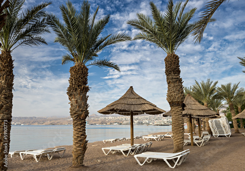Photo: Sandy beach of Eilat - famous resort city in Israel Sandy beach of Eilat - famous resort city in Israel