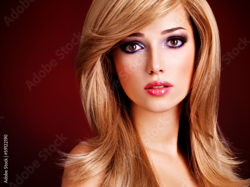 Photo: Closeup portrait of a beautiful young woman with long white hair Closeup portrait of a beautiful young woman with long white hair