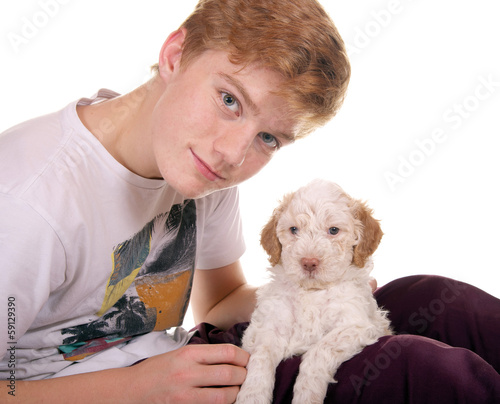 Photo: Junge mit Lagotto Romagnolo Welpe Junge mit Lagotto Romagnolo Welpe