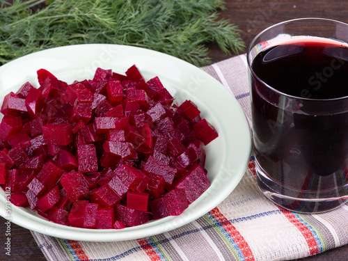 Photo: Fresh segments of a beet and beetroot juice Fresh segments of a beet and beetroot juice