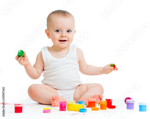 Photo: baby girl with paints baby girl with paints
