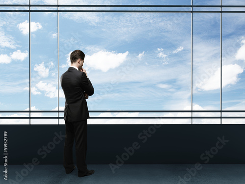 Photo: businessman looking to sky businessman looking to sky