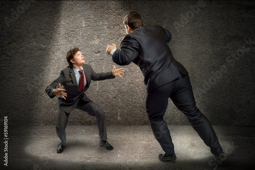 Photo: two businessmen fighting as sumoist two businessmen fighting as sumoist