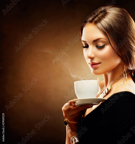Photo: Coffee. Beautiful Girl Drinking Tea or Coffee Coffee. Beautiful Girl Drinking Tea or Coffee