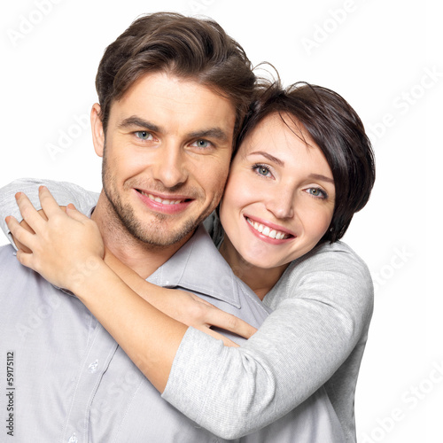 Photo: Closeup portrait of beautiful happy couple - isolated Closeup portrait of beautiful happy couple - isolated
