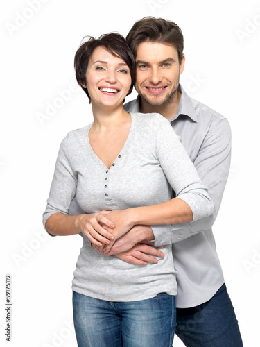 Photo: Portrait of happy couple isolated on white Portrait of happy couple isolated on white