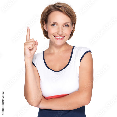 Photo: happy woman pointing up with her finger happy woman pointing up with her finger