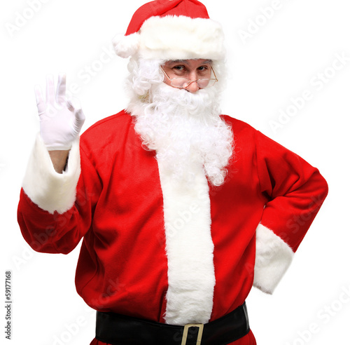 Photo: father Christmas or Santa Claus giving thumb up father Christmas or Santa Claus giving thumb up