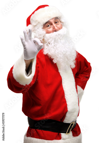 Photo: father Christmas or Santa Claus giving thumb up father Christmas or Santa Claus giving thumb up
