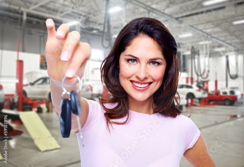 Photo: Beautiful woman with a car key. Beautiful woman with a car key.